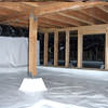 A large, encapsulated crawl space with our vapor barrier system installed in Chilliwack.