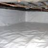 A crawl space vapor barrier has been installed on the walls and floors of this space in Burnaby.