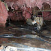 Fiberglass insulation dripping off some heating ducts in a wet crawl space in Hatzic.