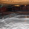 A sealed crawl space with support posts showing in North Vancouver.