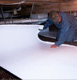 Chilliwack insulation being installed in a crawl space.