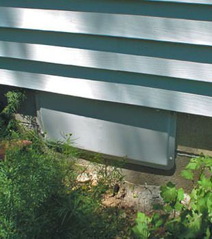A gray crawl space vent cover in Port Moody