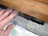 Clear plastic vapor barrier covering for block walls in Ladner