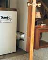 A dehumidifier being vented into a finished basement