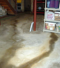 Flooding entering a basement through a floor crack in White Rock
