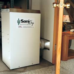A basement dehumidifier with an ENERGY STAR® rating ducting dry air into a finished area of the basement  in Anmore