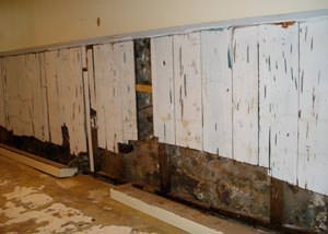 A wet, flooded finished basement in Hope