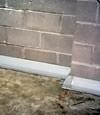 Our baseboard drain system installed on a corner in a Burnaby basement.