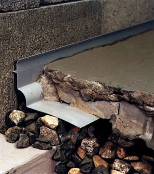 a custom designed basement drain system for thin basement floors in Ladner.