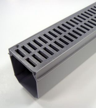 A closeup of our grated basement drainage pipe system, installed in Richmond