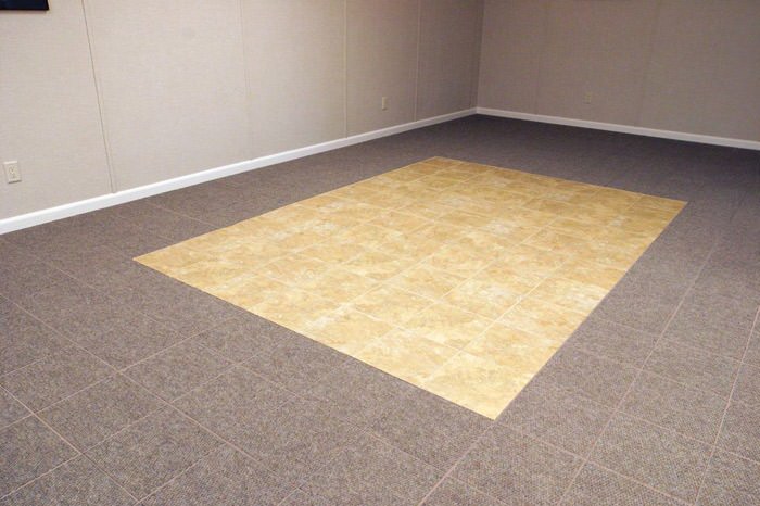 tiled and carpeted basement flooring installed in a North Vancouver home